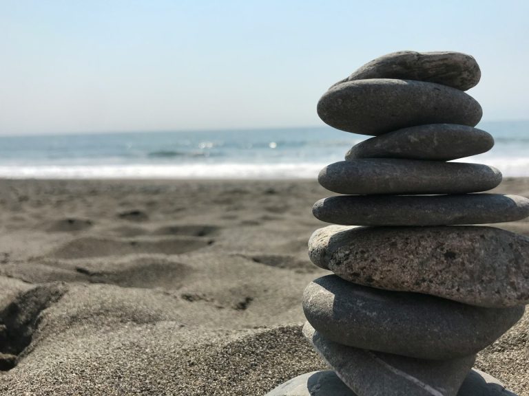 Inicio 16 Stack of stones on beach during daytime